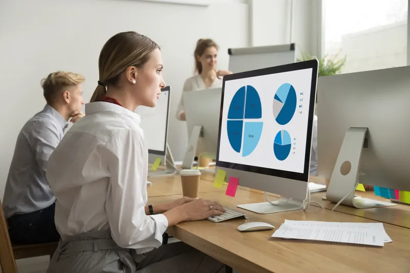 An HR professional managing claims at her desk