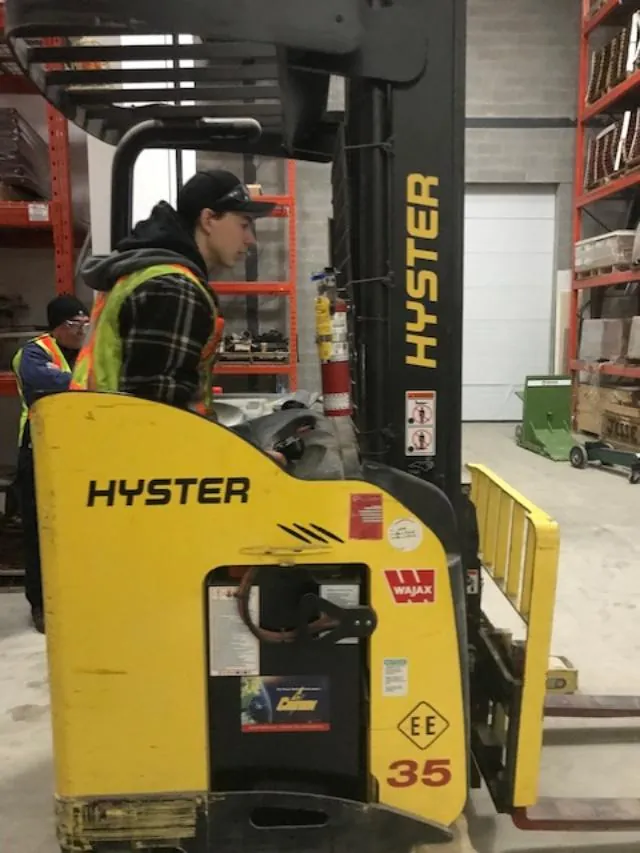 A trainee on a reach truck